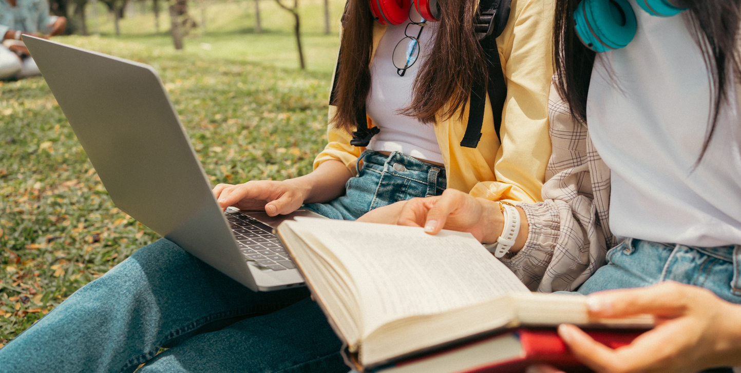 Close up of two college students studying outside